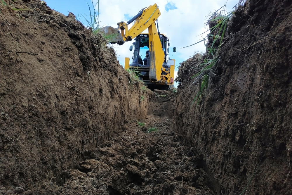excavator digging a trench